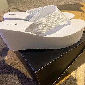 Size 9 never worn stacked white flip flops.